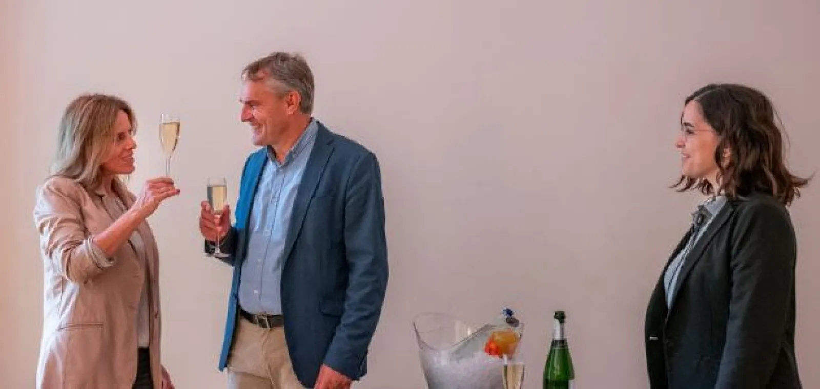 Visitors raising a glass of cava in the Mezzanine